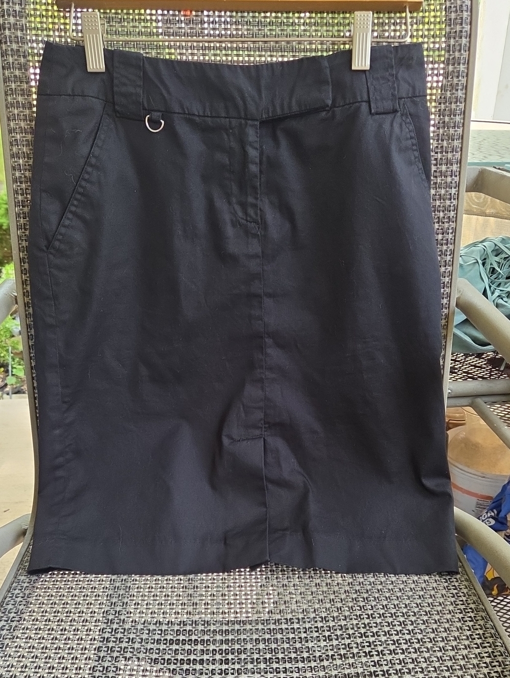 Kenar,classic black pencil,skirt with 4 pockets,and belt loops.
